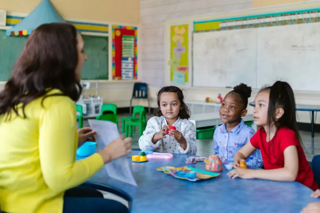 A teacher is teaching the students. 