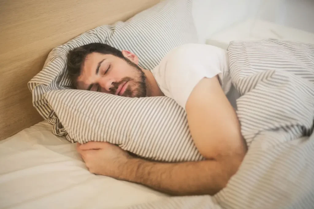 man sleeping on the bed