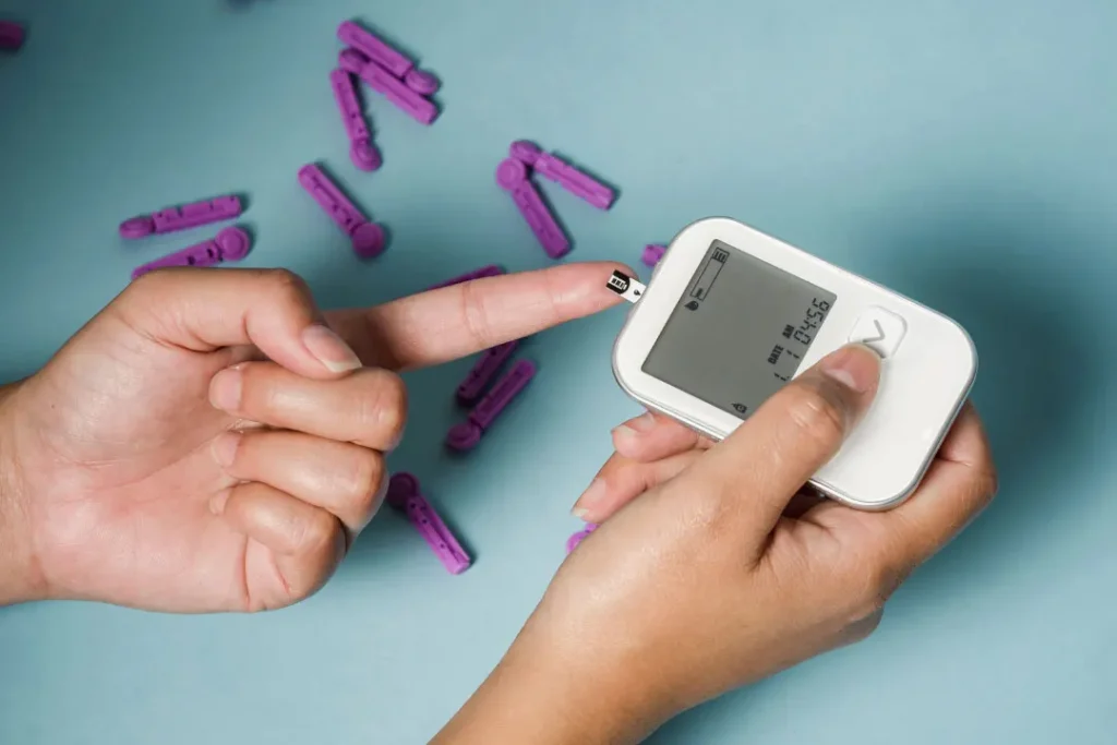 women checking blood sugar.