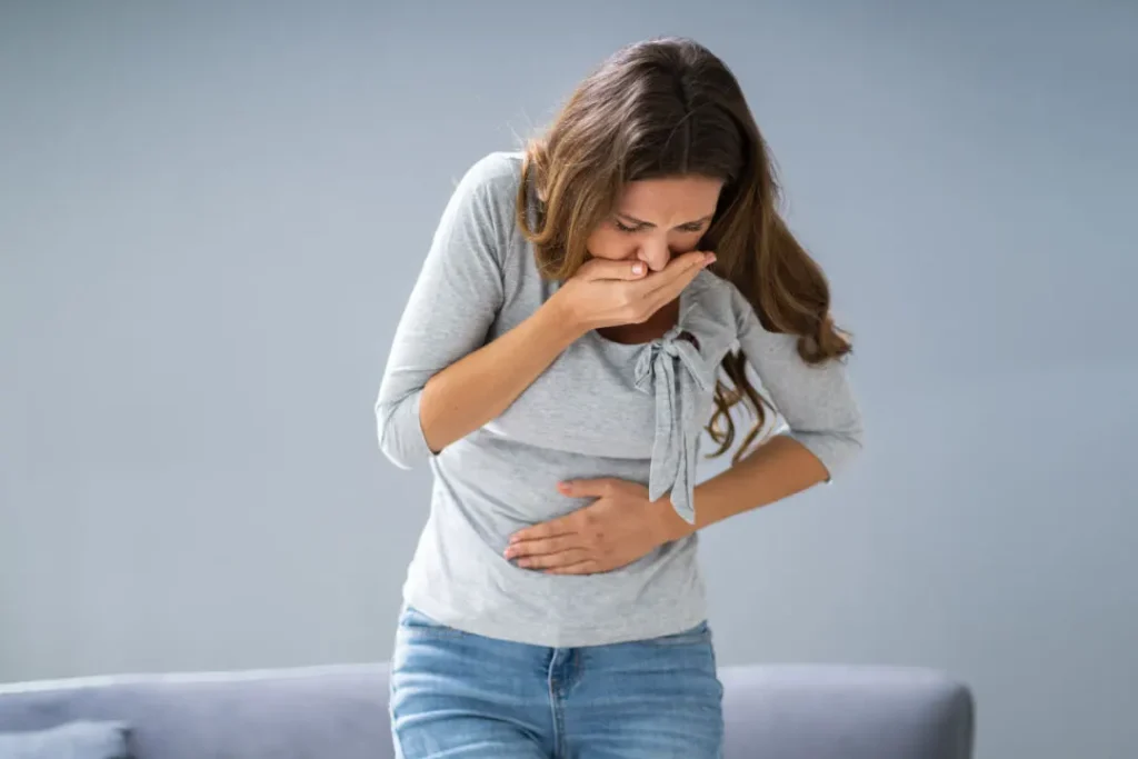 A lady having vomit. 