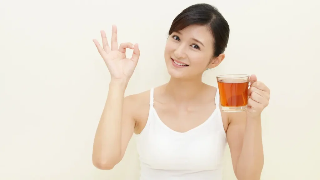 Lady having Black Tea. 