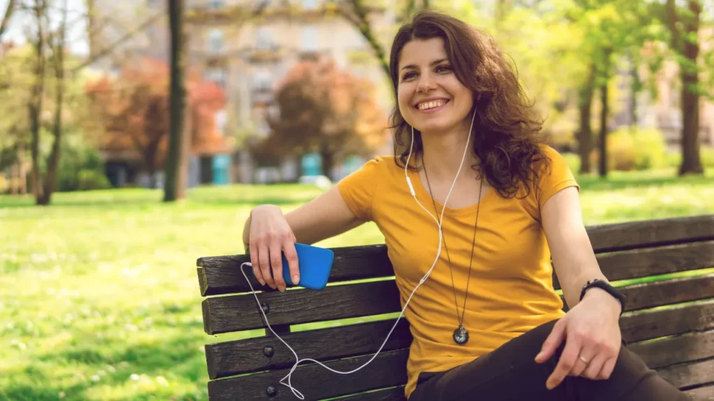 Lady is listening music. 