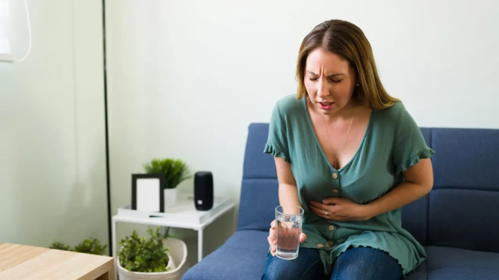 Lady having gastrointestinal pain. 