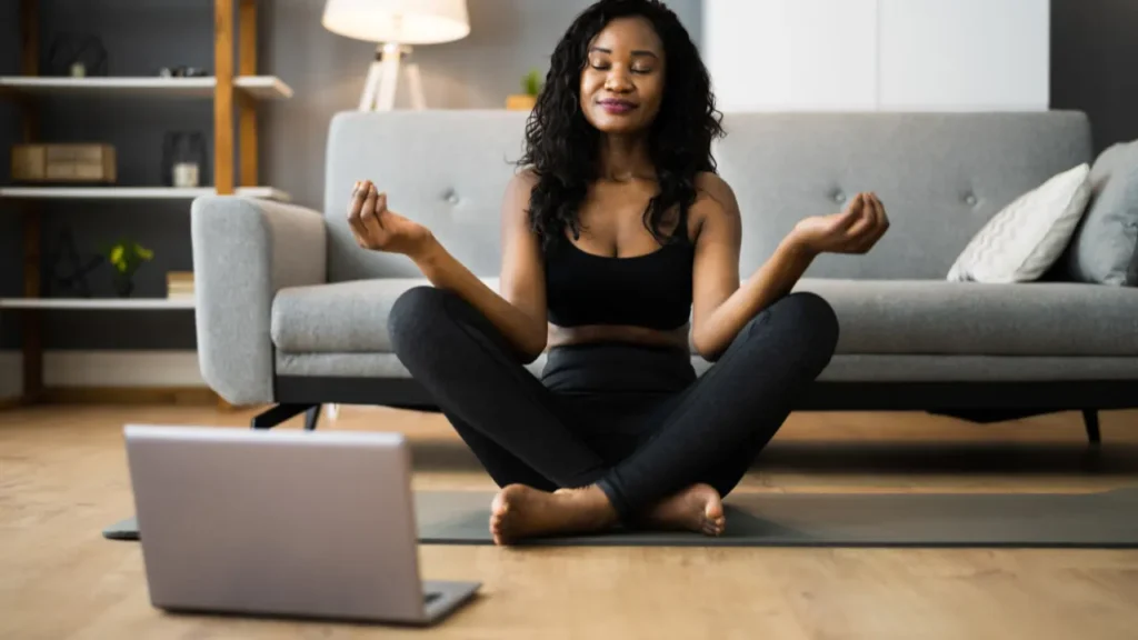 Lady is doing yoga. 