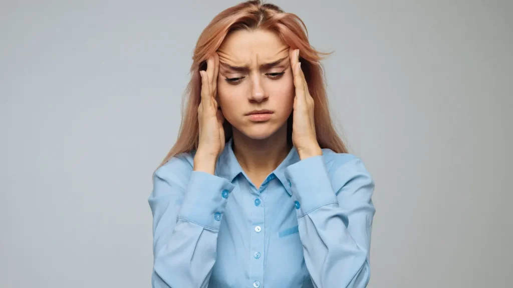 Girl facing headache. 