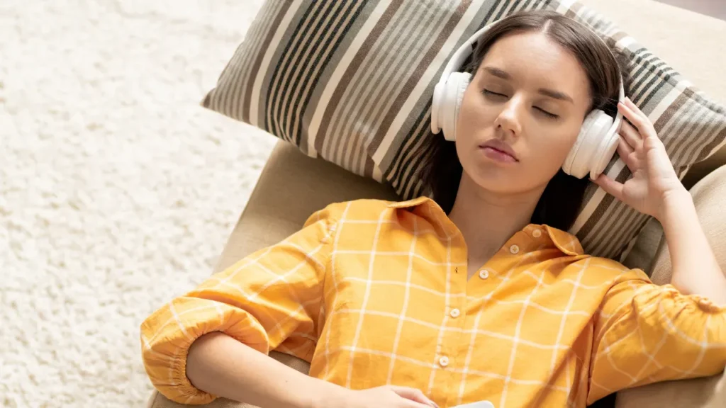 Young girl is listening music. 