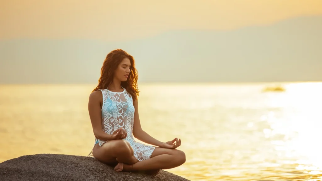 Young girl sitting at beach relaxing 