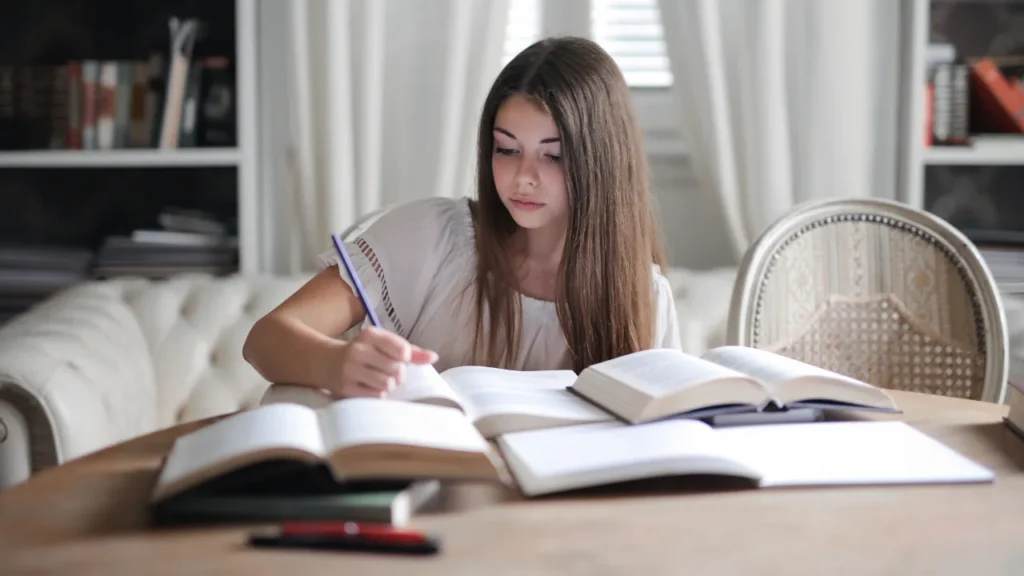 Lady reading the books. 